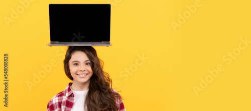 happy smart teen girl with laptop on head presenting school online lesson. School girl portrait with laptop, horizontal poster. Banner header with copy space.