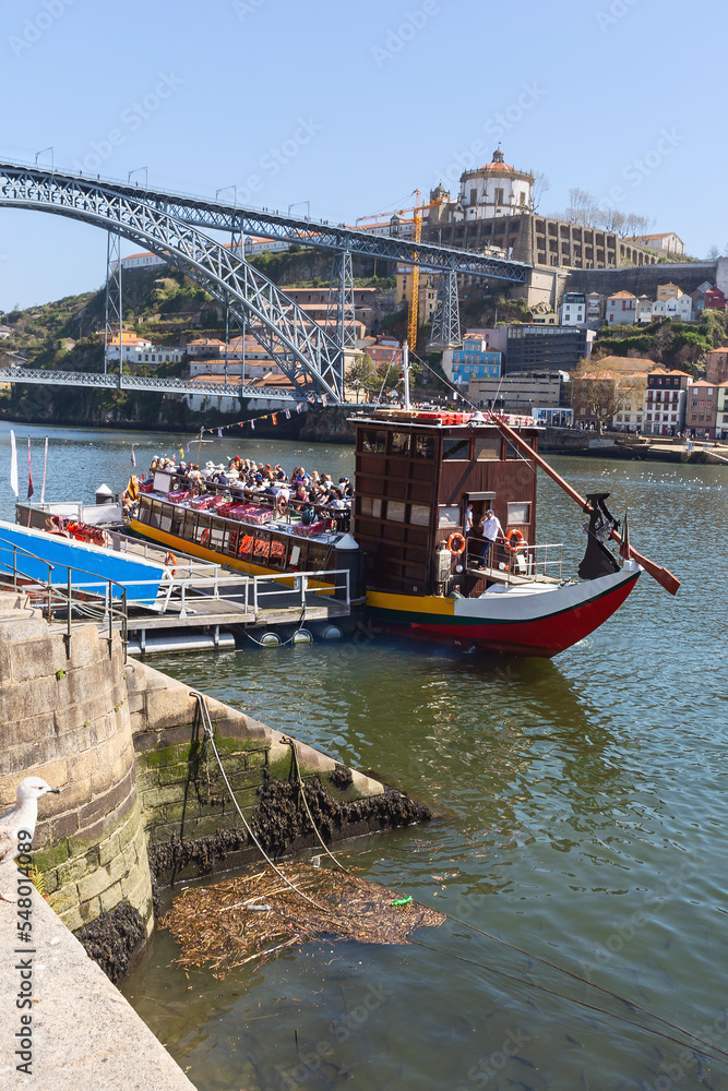 a small cruise liner with tourists is preparing to sail from the city pier. Travel concept. Porto. Portugal