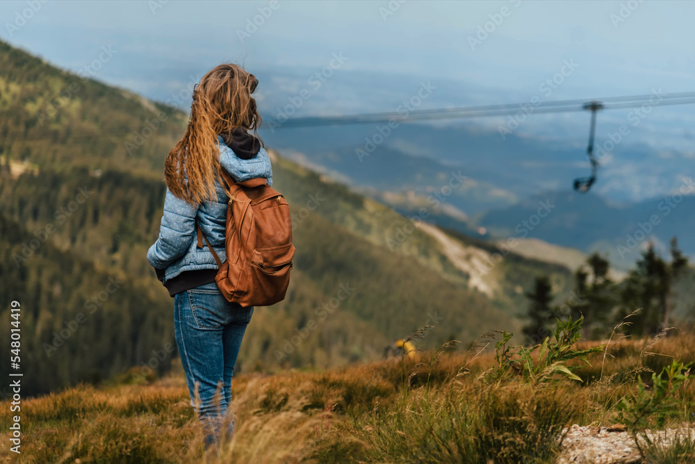 Woman Looking at Mountain Landscape at Summer Woman Looking at Mountain Landscape at Summer
