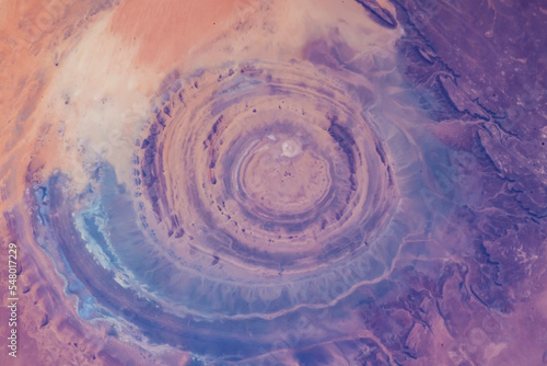 Fototapeta Naklejka Na Ścianę i Meble -  Eye of the Sahara in northwestern Mauritania Aerial view of Sahara desert. Natural abstract patterns and shapes in the nature. Colorful background. Elements of this image furnished by NASA