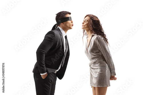 Photos Man with a blindfold kissing a woman in a dress