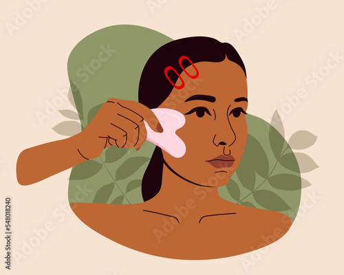 Beautiful woman massaging face with gua sha jade scraper. Girls beauty routine for skin care. Daily skin care routine and hygiene concept. Home skincare procedure, treatment. Flat vector illustration.