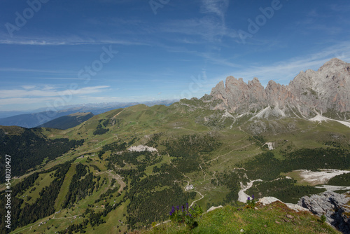 wide view of an alpine valley among the Dolomites in Val Gardena