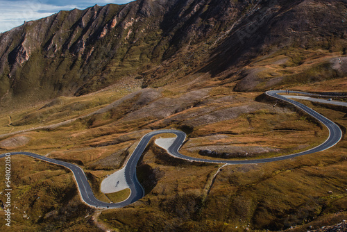 View of the Austrian Alps on the Grossglockner. Sunny day in the mountains. Landscape and srpentine road.