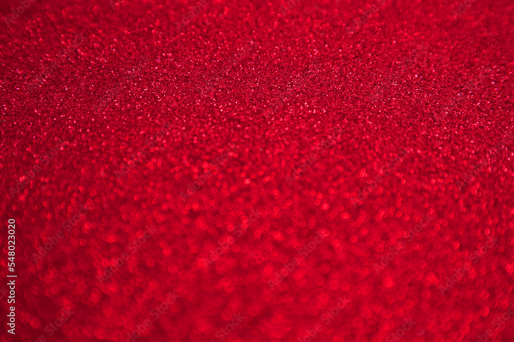 Shiny red black blurred background for holiday design. Christmas abstract sparkles, selective focus Shiny red black blurred background for holiday design. Christmas abstract sparkles, selective focus