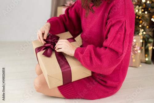 Anonymous woman holding gift box in hands,festive concept. photo