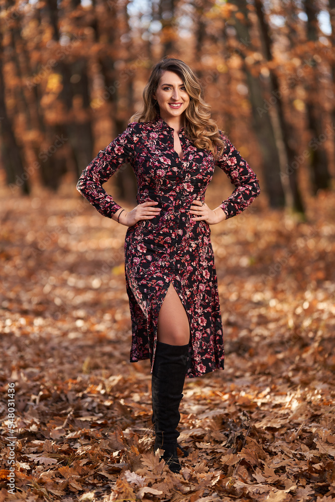 Size plus woman in a forest in the autumn Size plus woman in a forest in the autumn