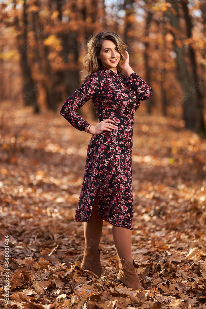 Size plus woman in a forest in the autumn Size plus woman in a forest in the autumn