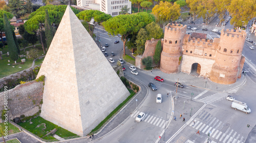 Photography Aerial view of Ostiense square and Pyramid of Cestius, a Roman Era pyramid located in Rome, Italy