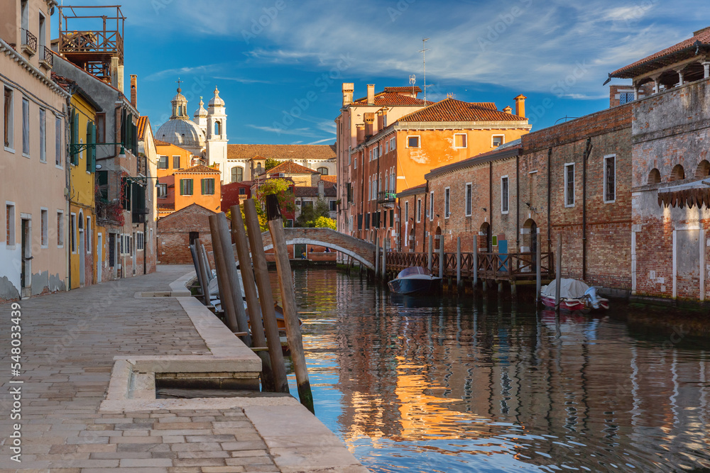 Typical Venetian canal with bridge and church in the early morning, Dorsoduro, Venice, Italy