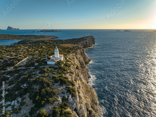 Isolated Lighthouse on the West Coast of Ibiza photo