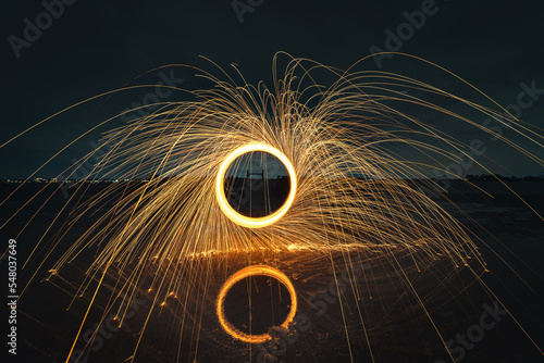 Turning steel wool on fire in the air above the water