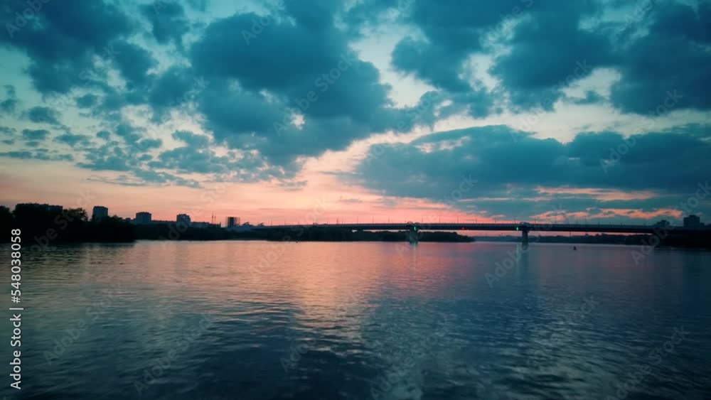 Aerial 4k view. Stunning sunset sun over the river. Flying above the surface of the water Aerial 4k view. Stunning sunset sun over the river. Flying above the surface of the water