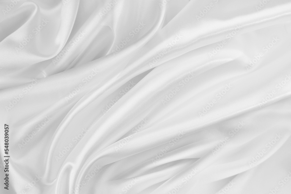 Rippled white silk fabric texture background
