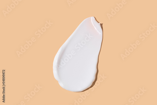 White cream smudge swatch textured on beige background 