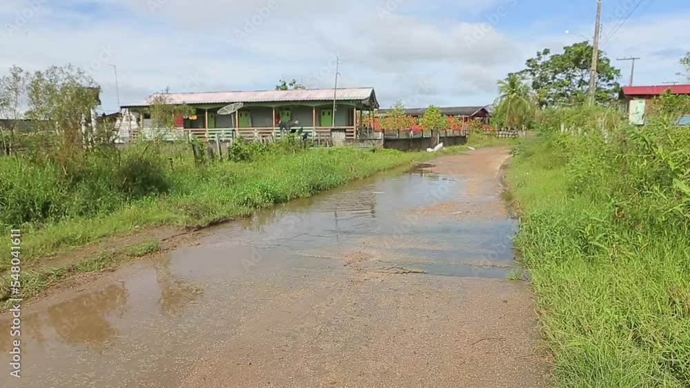 STREET COVERED BY FLOOD WATER OF THE AMAZONAS RIVER STREET COVERED BY FLOOD WATER OF THE AMAZONAS RIVER