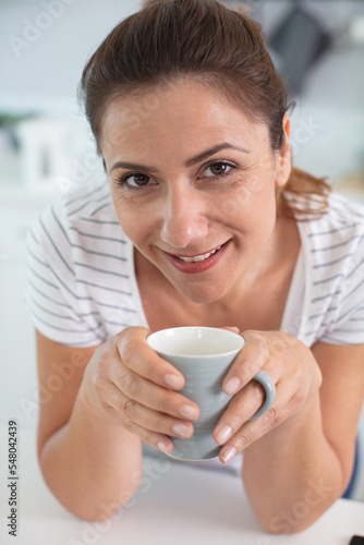 portrait of woman smiling in coffee shop