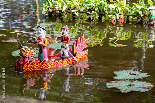 Vietnam, Hanoi, Water puppet show in public garden.