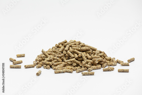 Fraction of feed additives for animals on a white background in the form of a pyramid