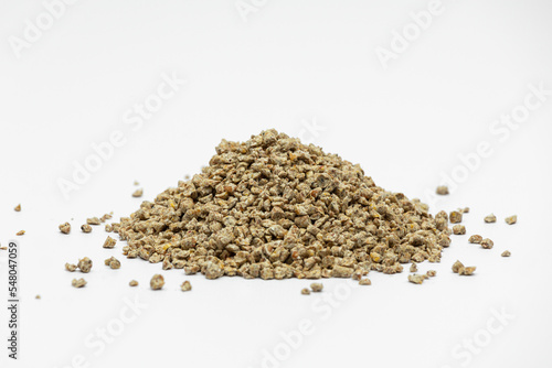 Fraction of feed additives for animals on a white background in the form of a pyramid