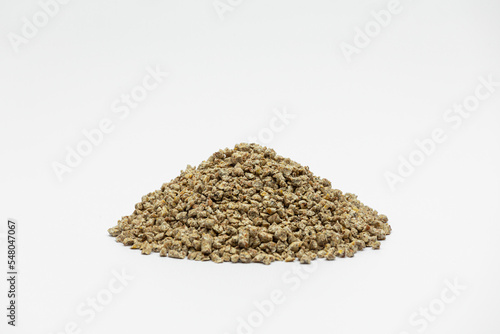 Fraction of feed additives for animals on a white background in the form of a pyramid