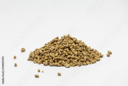 Fraction of feed additives for animals on a white background in the form of a pyramid