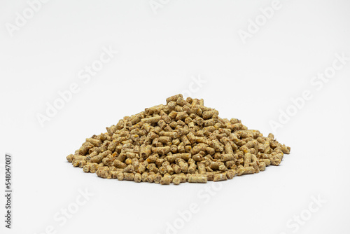 Fraction of feed additives for animals on a white background in the form of a pyramid