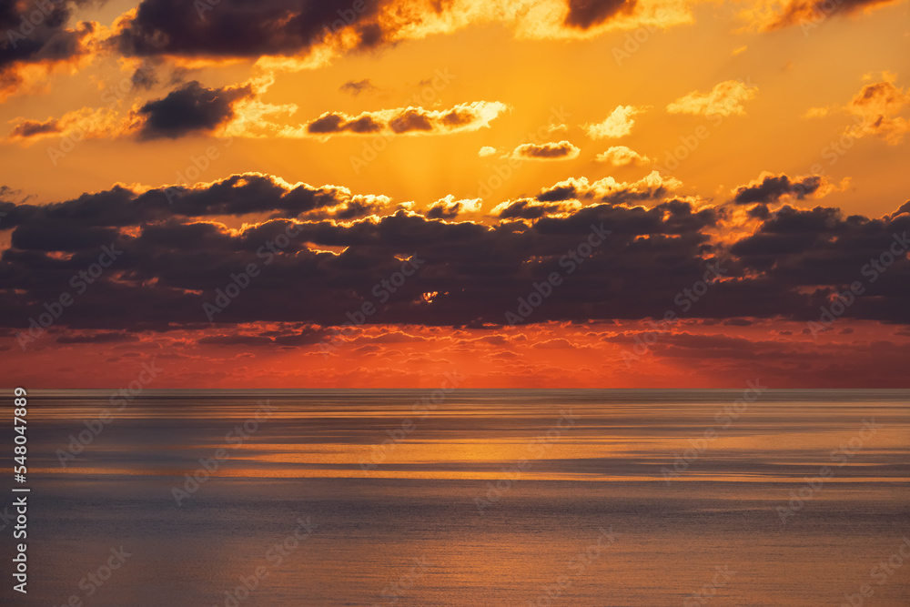 Dramatic Colorful Sunrise Sky over Mediterranean Sea. Abstract Red Sky. Cloudscape Nature Background.