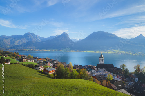 Scenic mountain lake view of the charming lakefront town St. Wolfgang im Salzkammergut in the Dachstein alps range in Austria. photo