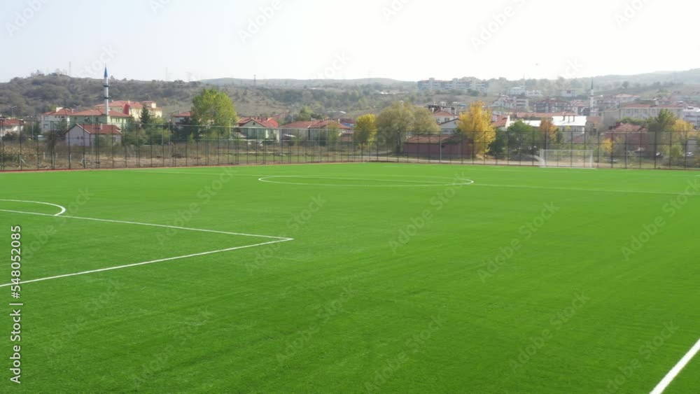Artificial turf (grass) carpet, football field. Aerial drone 4K video shooting Artificial turf (grass) carpet, football field. Aerial drone 4K video shooting