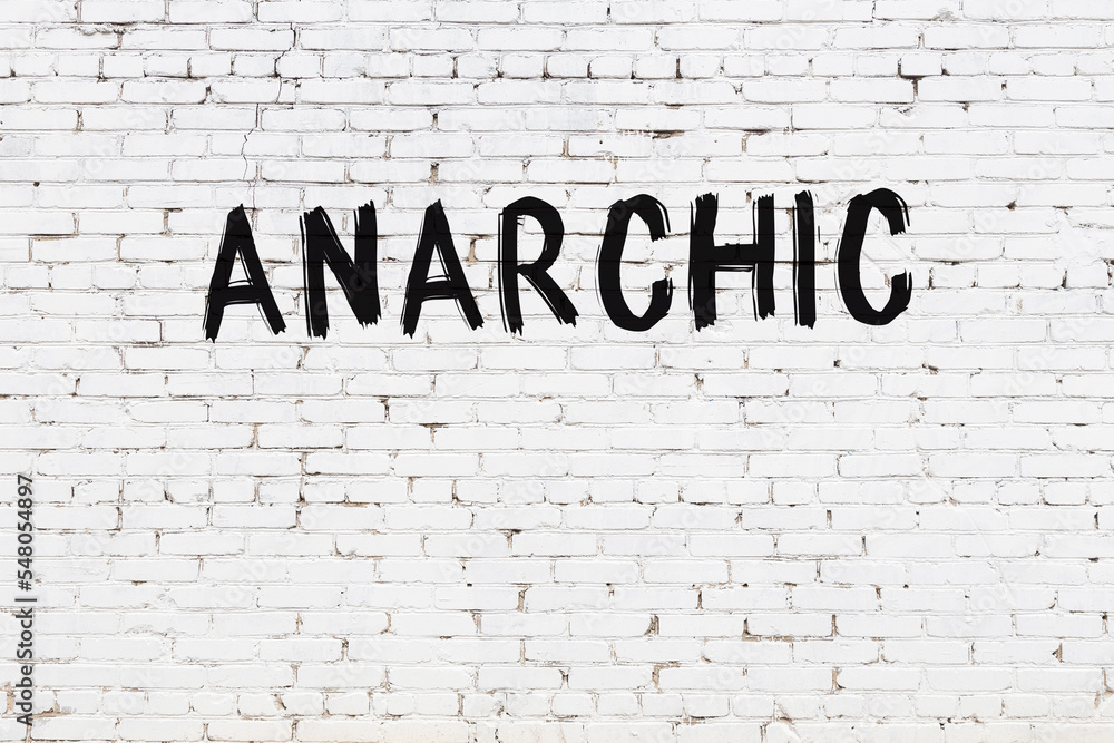 Samolepka White wall with black paint inscription anarchic on it