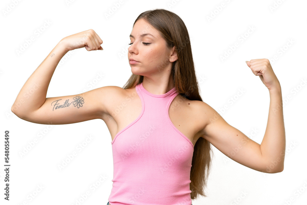 Young beautiful blonde woman over isolated background doing strong gesture Young beautiful blonde woman over isolated background doing strong gesture