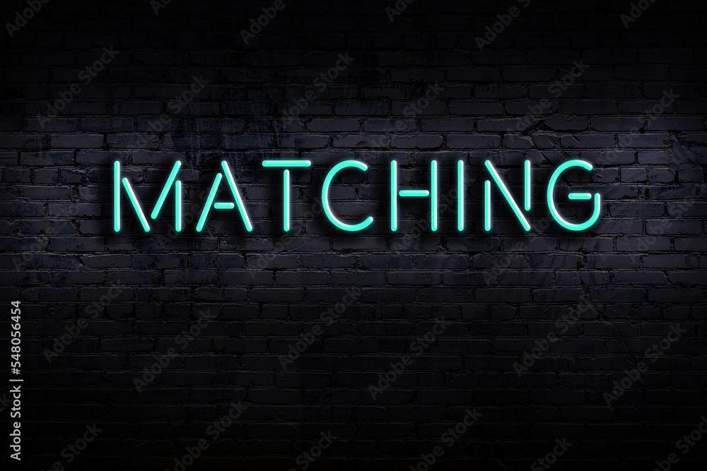 Ταπετσαρία Neon sign. Word matching against brick wall. Night view