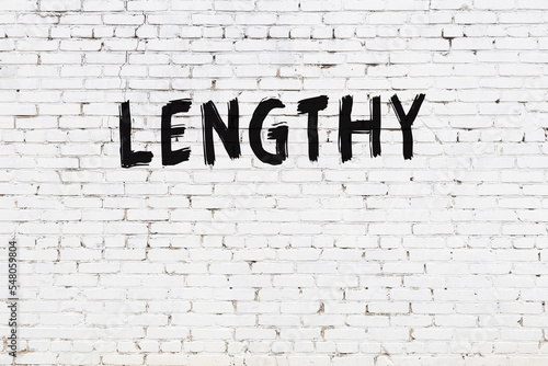Принти на полотні Inscription lengthy painted on white brick wall