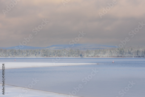 Canadian forest lake after the first snows of November. Province of Quebec