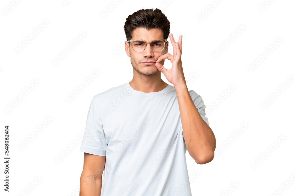 Young caucasian handsome man over isolated background showing a sign of silence gesture Young caucasian handsome man over isolated background showing a sign of silence gesture