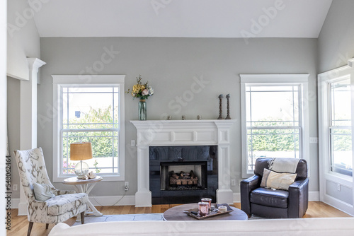 A light and bright open concept living room den with vaulted ceilings in a new construction house