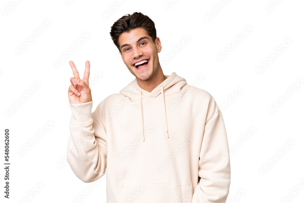 Young caucasian handsome man over isolated background smiling and showing victory sign Young caucasian handsome man over isolated background smiling and showing victory sign