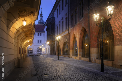Night street near the Carolinum - historical building of Charles University in Prague at night with lanterns. Prague.