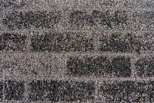 Tablou pe pânză Background from a wall or roof covered with bitumen and gravel close-up