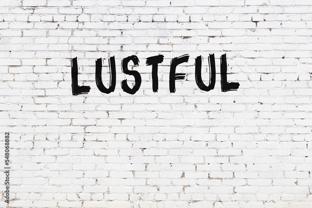 White wall with black paint inscription lustful on it - obrazy, fototapety, plakaty 