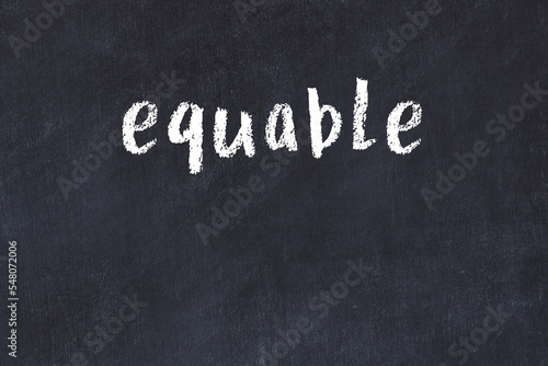Black chalkboard with inscription equable on in