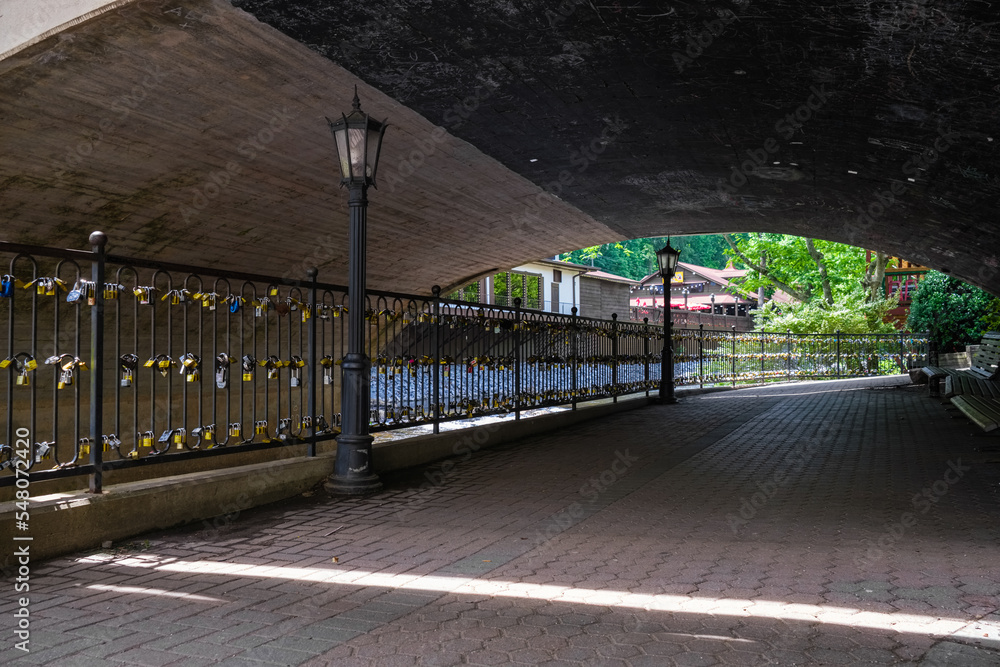 Fototapeta premium Helen Georgia Cityscape with the Chattahoochee River and tourist locks under the bridge