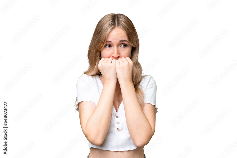 Young English woman over isolated background nervous and scared putting hands to mouth Young English woman over isolated background nervous and scared putting hands to mouth