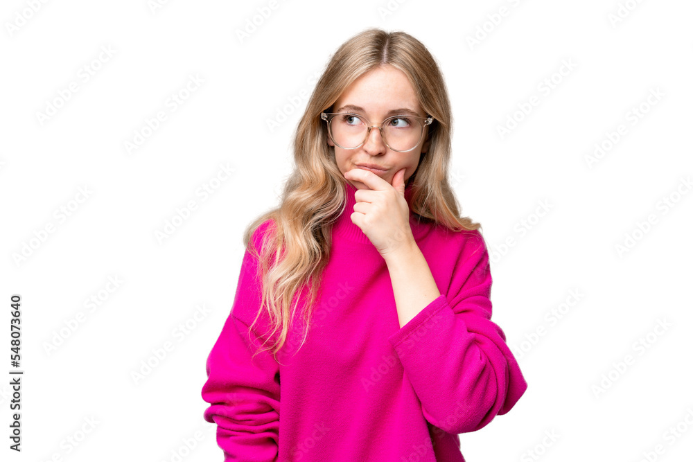 Young English woman over isolated background having doubts and with confuse face expression Young English woman over isolated background having doubts and with confuse face expression