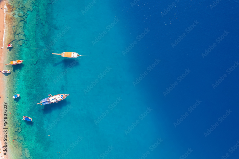 Aerial top view white yacht on beach of Oludeniz and blue lagoon Turkey Fethiye
