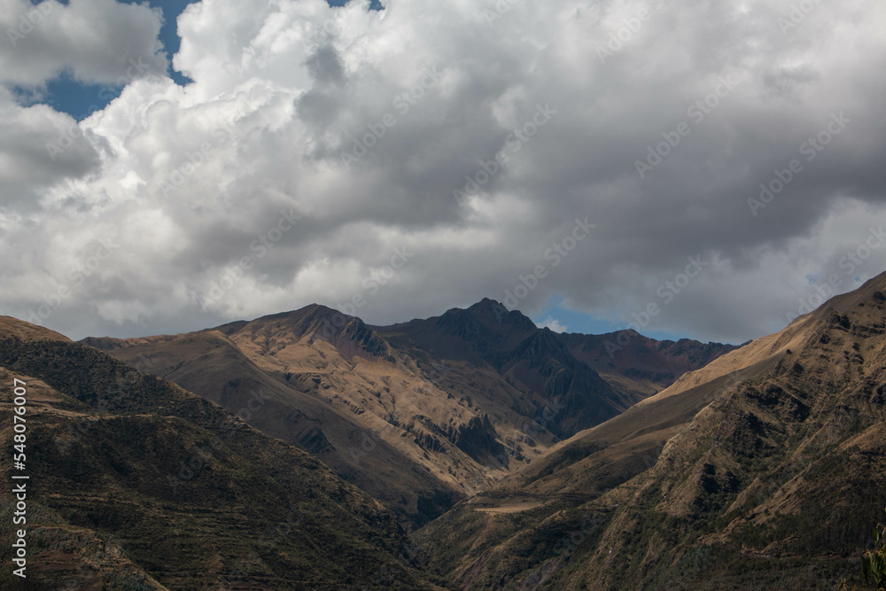 View of the mountains of Limatambo with incredible huge white clouds, Peru. 