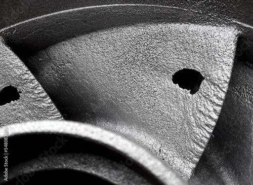 Water supply system. Quarry for the extraction of minerals Mine in the mountain. Slurry pressure pump wheel. Accident from friction and quits, defect - hole. Color image.