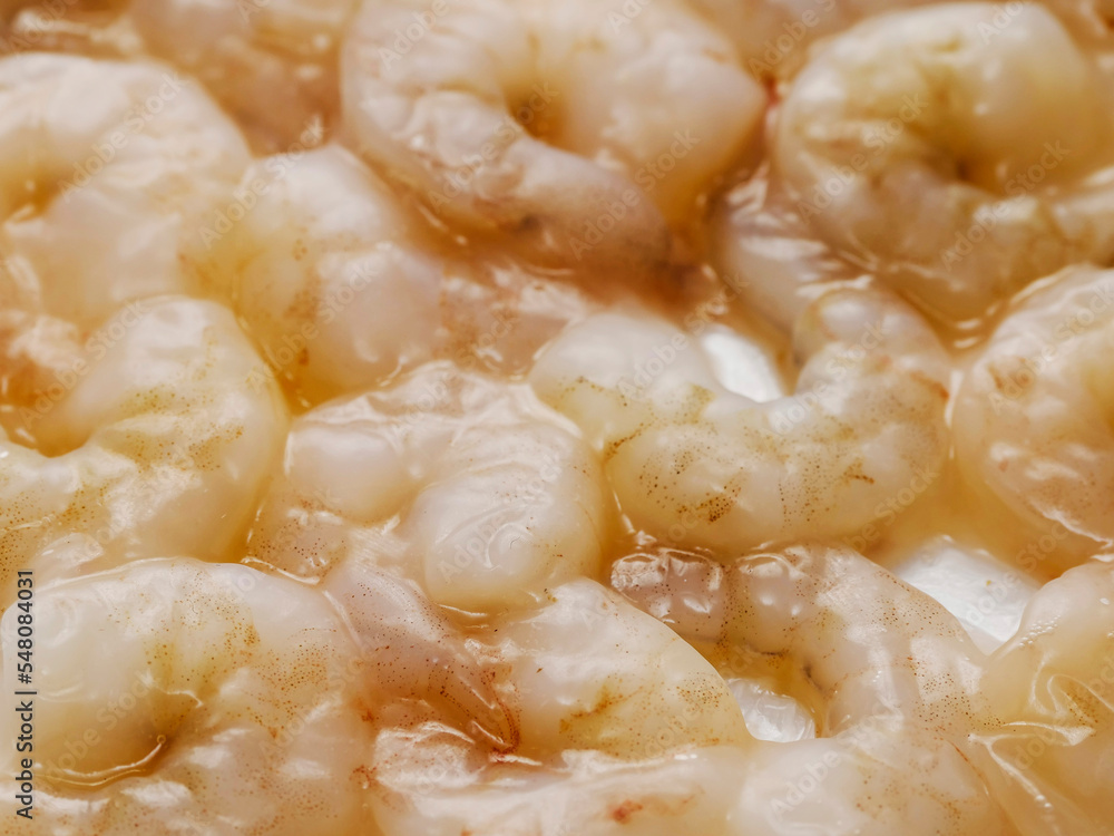 Close up of uncooked, raw prawn or shrimp. High quality seafood product. Close up of uncooked, raw prawn or shrimp. High quality seafood product.