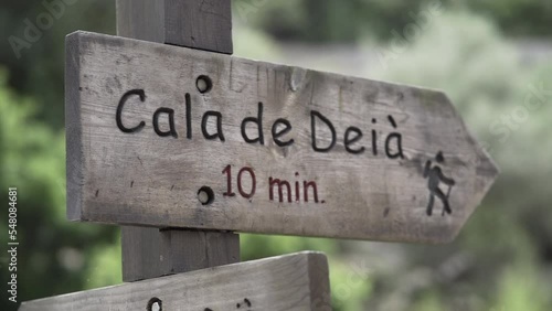 Slow motion video of a rustic wooden sign written in catalan language photo